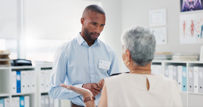 Black man, healthcare and tablet with patient for consultation, checkup or results at clinic. Medical professional, technology and office for schedule, diagnosis or heart disease of elderly woman