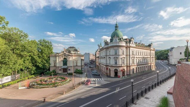 Panorama showing Theater Square with Main Post Office building aerial timelapse and Polish Theater, both built in 1890s, view from the Castle hill. Traffic on the street. Bielsko-Biala, Poland