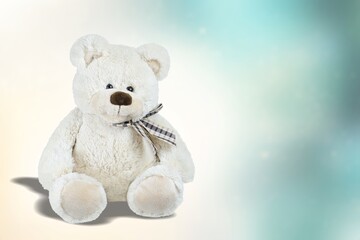 Stuffed cute soft toy on background