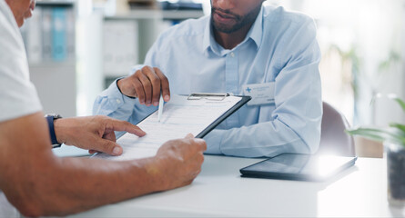 Man, doctor and hands with form in consultation for signature, application or health insurance at...