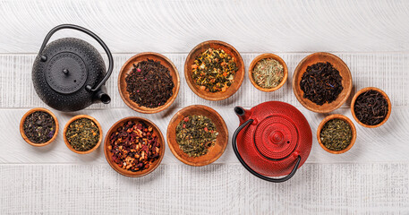 A collection of various teas nestled in wooden bowls