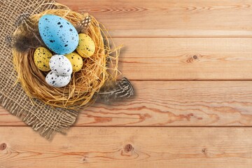 Plate of colored Easter eggs on desk