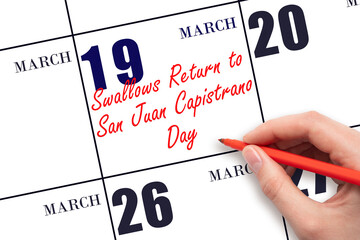 March 19. Hand writing text Swallows Return to San Juan Capistrano Day on calendar date. Save the...
