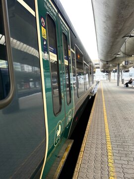 train in motion, olso city, grey and green coulors.