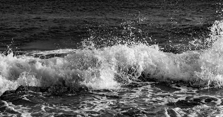 Breaking waves panorama in contrasting black and white. Surf at “Grand Anse des Salines“ – a...