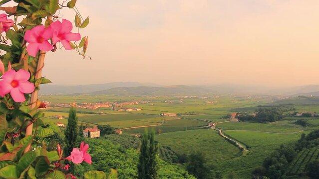 Panning shot of breathtaking sunset over idyllic Italian countryside near Verona
