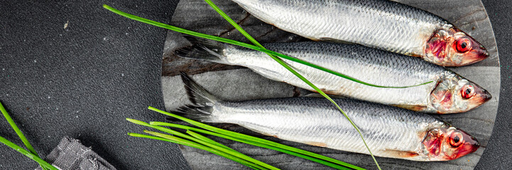 fresh herring fish raw seafood tasty fresh eating cooking meal food snack on the table copy space food background rustic top view Pescetarian diet