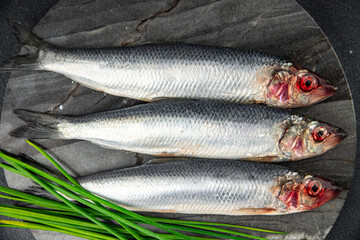 fresh herring fish raw seafood tasty fresh eating cooking meal food snack on the table copy space food background rustic top view Pescetarian diet