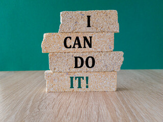 I can do it symbol. Concept words I can do it on brick blocks. Beautiful green background, wooden...