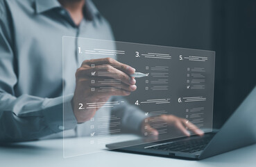 Businessman evaluating questionnaire on laptop computer on internet website. assessment online,...