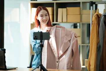 Entrepreneur Showcasing Clothes for Online Store