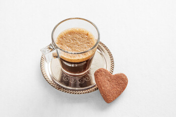Cup of coffee and heart-shaped cookies for Valentine's Day