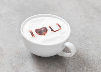 Holiday Cappuccino with the inscription cocoa on the milk foam 