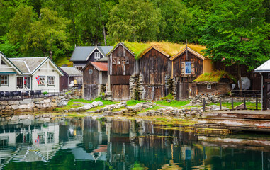 Fototapeta premium View on the coast of Geirangerfjord in town Geiranger, one of the most beautiful fjords in Norway
