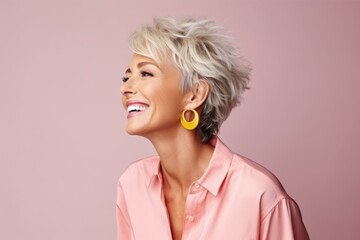 Portrait of a beautiful middle-aged blonde woman with short hair.