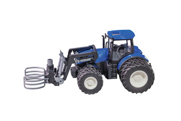 Close-up view of radio-controlled miniature agricultural tractor model isolated on white background. 