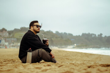 Shoreline Serenity: Mate and Sunglasses by the Sea