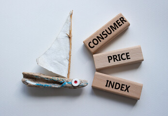 Consumer Price Index symbol. Concept words Consumer Price Index on wooden blocks. Beautiful white...
