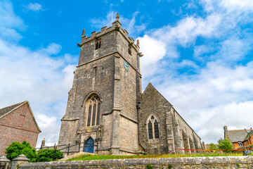 Fototapeta na wymiar The 12th century St Edwards church, the Parish Church of Corfe Castle, Dorset, in the picturesque village of Corfe Castle, England, UK