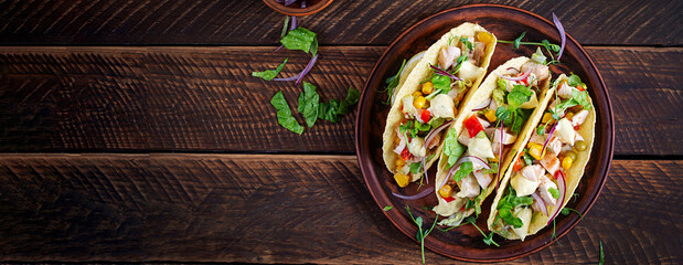 Mexican tacos with chicken meat, corn and salsa. Healthy tacos. Diet menu. Mexican taco. Top view, banner