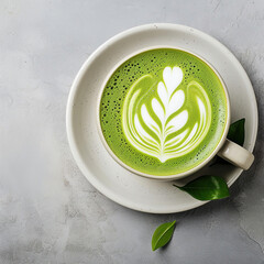 Close up cup of green tea matcha latte in white cup with powder, latte art, hot green tea, milk, soy milk, traditional beverage