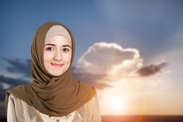 Muslim arab woman posing on sky background