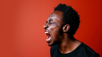 Obraz premium Fearful and Anxious Southern African Man, Isolated on Solid Background - Copy Space Provided