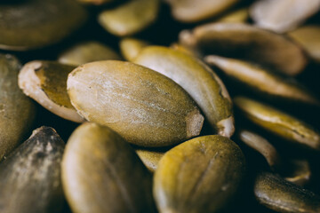 Hulled pumpkin seeds in a large pile. Pumpkin seeds
