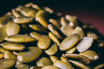 Hulled pumpkin seeds in a large pile. Pumpkin seeds