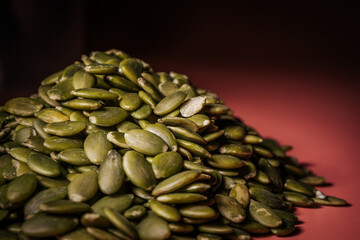 Hulled pumpkin seeds in a large pile. Pumpkin seeds