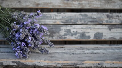  a bunch of lavender flowers sitting on top of a wooden bench in front of an old wooden planked wall and a wooden bench behind it is a wooden slatted surface. - obrazy, fototapety, plakaty