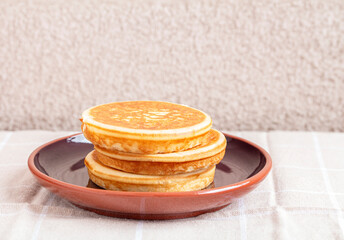 Golden pancakes in close-up on a gray background - 734212896