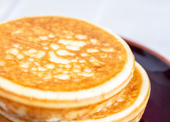 Stack of pancakes isolated on light background - 734213218