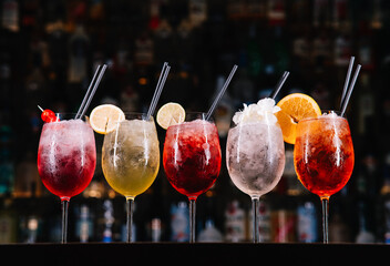 Mix of colourful cocktails on a bar