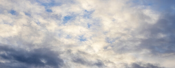 High light and dark clouds are illuminated by sunlight