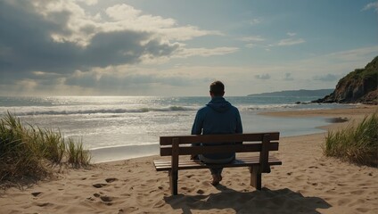 A Person Sitting on A Wooden Bench on The Beach