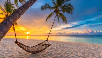tropical sunset beach and sky background as exotic summer landscape with beach swing or hammock and white sand and calm sea beach banner paradise island beach vacation or summer holiday destination