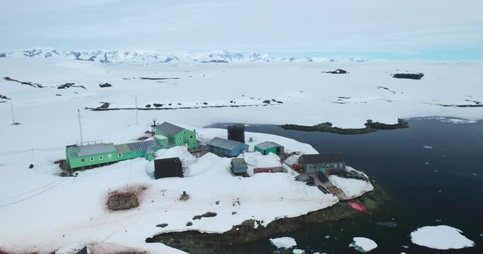 Antarctic Ukrainian Polar Station Vernadsky aerial panorama. South Pole exploration science base on wild nature peninsula. Snow covered mountain winter landscape. Research weather global warming issue