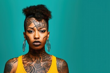 Young woman with face and neck tattoos serious face portrait