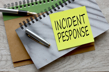 gray notepad on the table. text on page INCIDENT RESPONSE