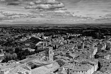 Fototapeta premium Siena Italy 09 30 2022: Old Medieval city in Tuscany in Europe. Art and culture. Tourists from all over the world for Piazza del Campo Palio Duomo Tower del Mangia and the oldest bank banco dei Paschi