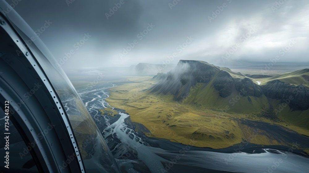 Poster an aerial view of a mountain range with a river in the foreground and a river running through the mi