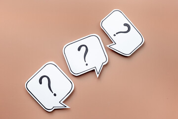 Question marks on paper speech bubbles. FAQ concept or search information concept