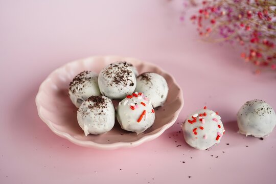 Homemade Cookie truffles or Balls coated in white chocolate, selective focus