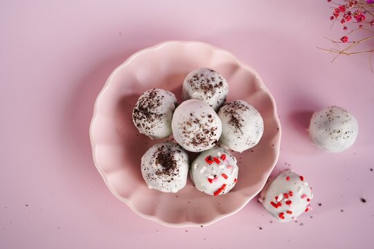 Homemade Cookie truffles or Balls coated in white chocolate, selective focus