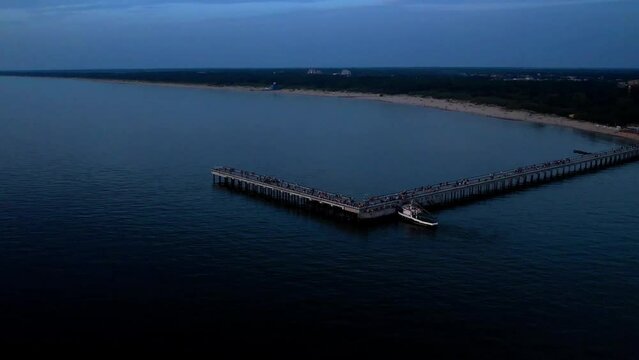 BRIDGE TO THE SEA IN PALANGA AFTER SUNSET. BEAUTIFUL NATURE IN LITHUANIA
