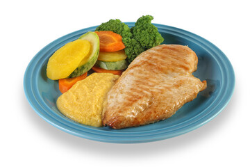 grilled chicken fillet with vegetables on plate on cutout background