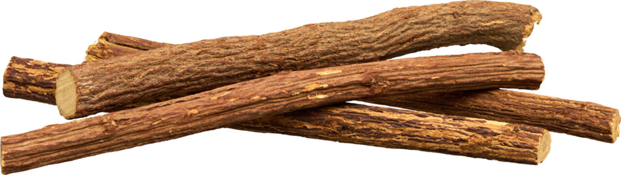 Natural dried licorice root sticks in a horizontal pile isolated on transparent background