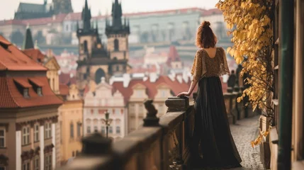 Foto op Canvas Portrait of Medieval woman in balcony with rooftop view of Prague city in Czech Republic in Europe. © Joyce