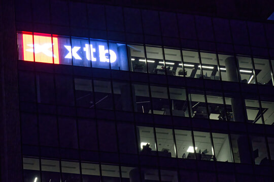 XTB company logo, signage, emblem on the facade. Polish trading platform, online broker, global leader in FX and CFD trading. Warsaw Poland - February 13, 2024